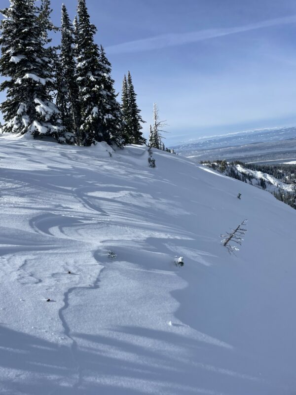 Wind affected snow from north winds along ridge line 