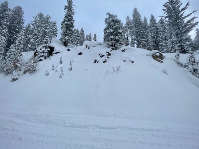 Natural loose snow avalanches in the soft snow surface along the steep road banks 